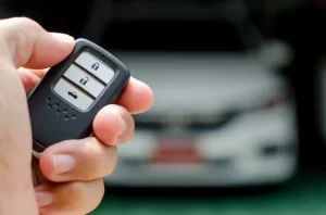 car-smart-key-is-an-electronic-access-and-authorization-system-hand-holding-smart-key-of-car_416458-296